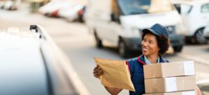 woman courier making a package delivery